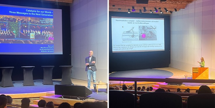 Två föreläsare presenterar vetenskapliga ämnen inför publik i en modern föreläsningssal.